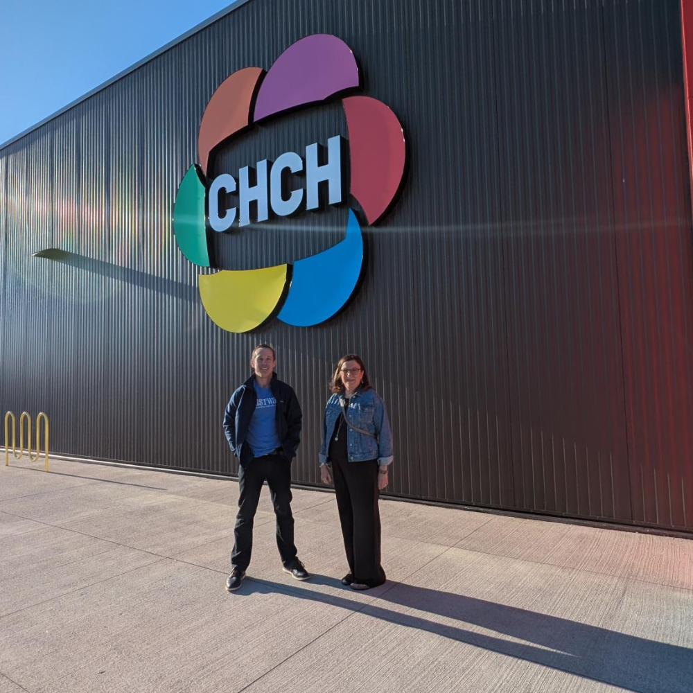 Two HFHT staff members stand outside the CHCH television studio.