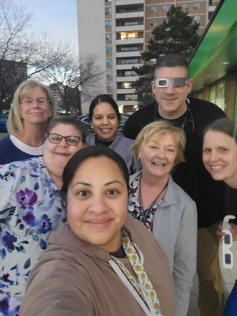 Harvard Square Family Physicians Practice Team during the solar eclipse.