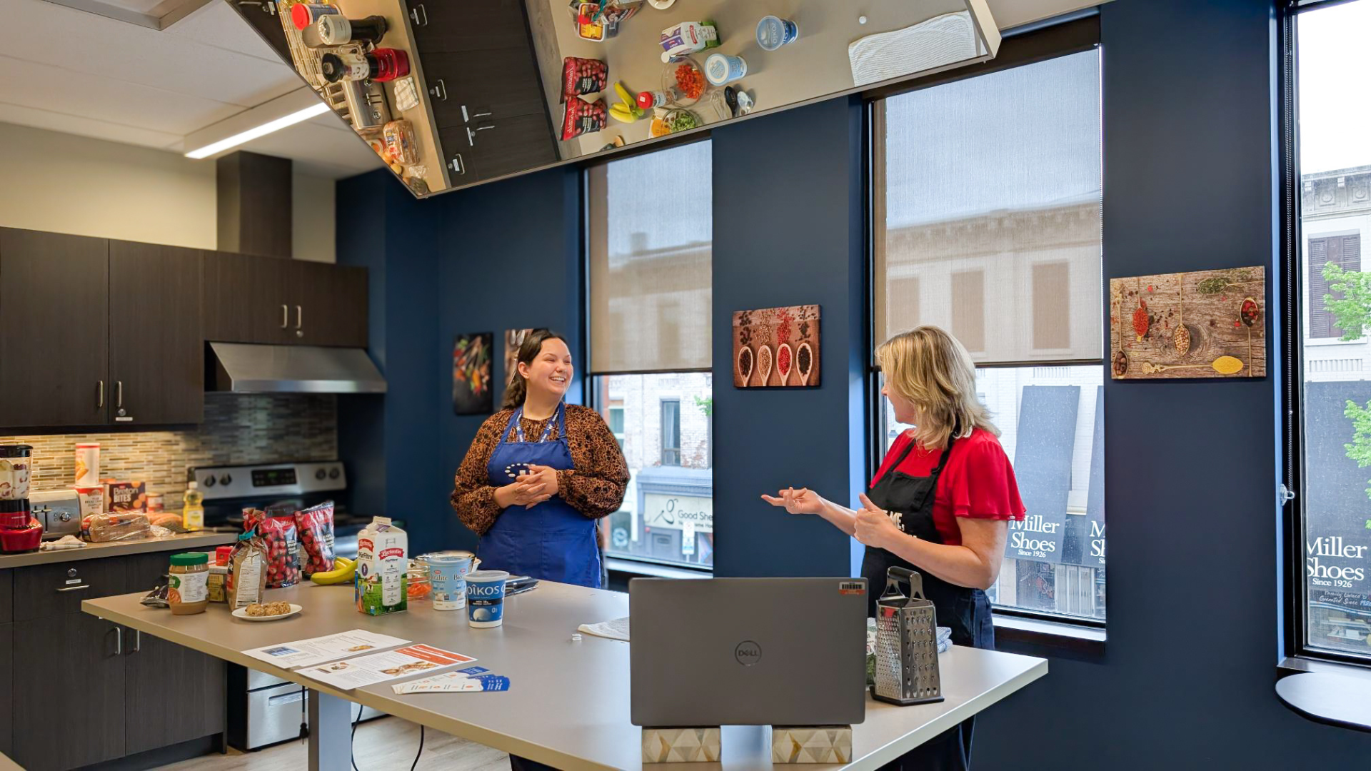 Two HFHT Registered Dietitians lead a Budget-Friendly Cooking workshop.