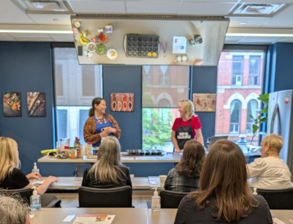 Budget Friendly Cooking facilitators engaging with participants.